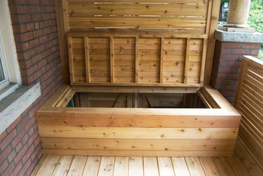 Front porch with built in garbage storage bench