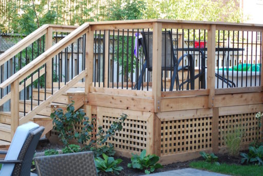 Cedar deck surrounding above ground pool